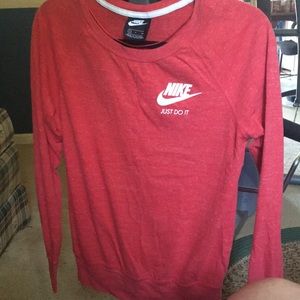 Woman’s small Nike reddish orange long sleeve shirt